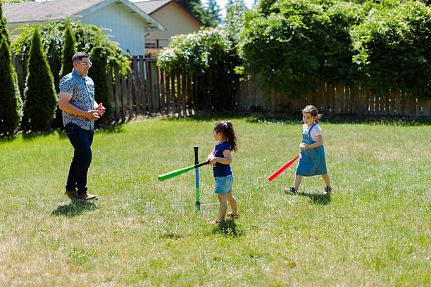 istock Latino Father and children Playing Together in backyard 2235794472