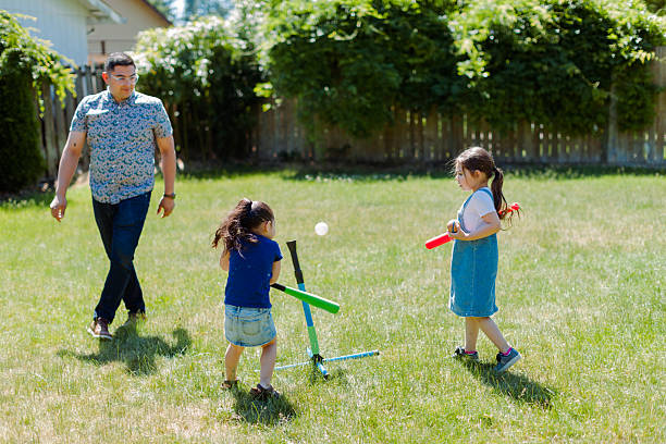 istock Latino Father and children Playing Together in backyard 2235794498