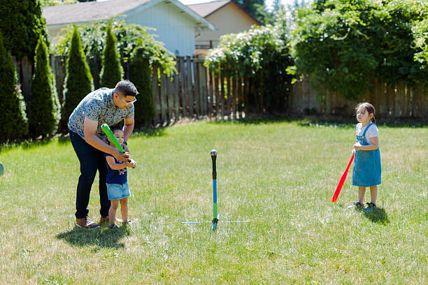 istock Latino Father and children Playing Together in backyard 2235794500