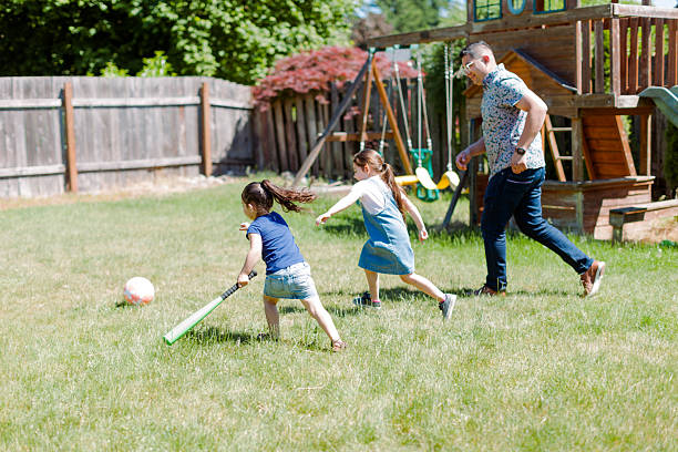 istock Latino Father and children Playing Together in backyard 2235794559