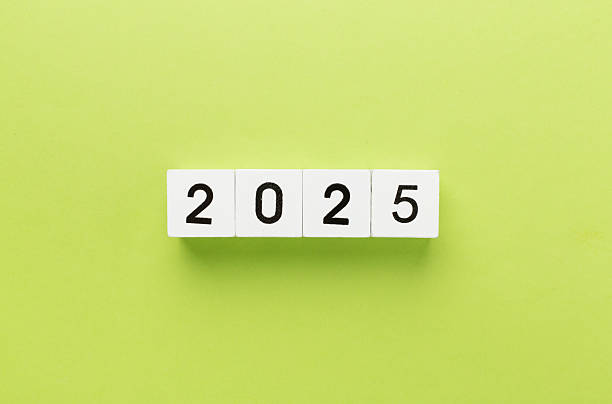 istock Cubes with 2025 on color background, top view 2235795219