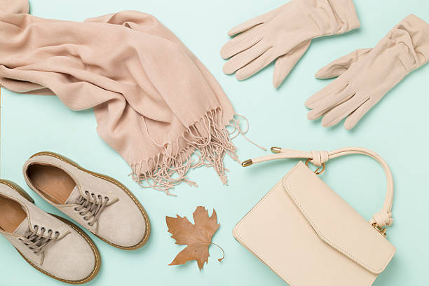 istock Stylish autumn accessories on color background, top view 2235795303