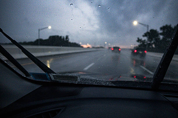 istock Dark Blurred View Through Speeding Car Rain Storm Windshield 2235795746