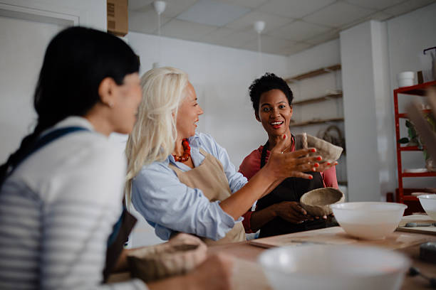 istock Multicultural Group of Three Women Decorating Pottery in Workshop 2235799168