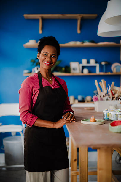istock Proud African American Woman Standing in Her Pottery Studio 2235800183