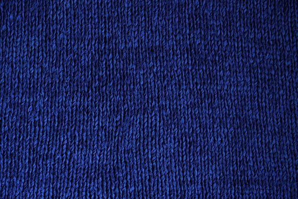 blue electric blue knitted stockinette texture close-up – front side of wool fabric
