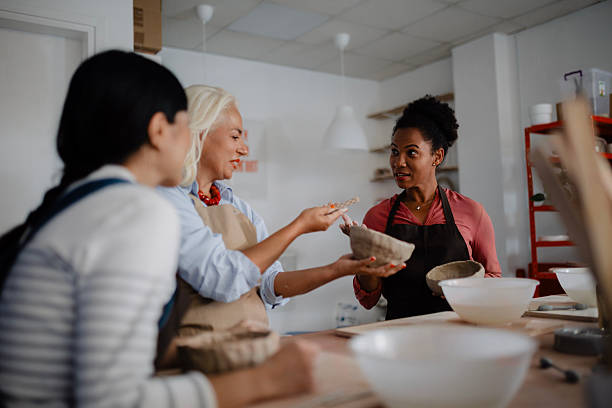 istock Multicultural Group of Three Women Decorating Pottery in Workshop 2235804822