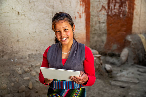 istock Tibetan young woman using digital tablet, Upper Mustang, Nepal 2235804897