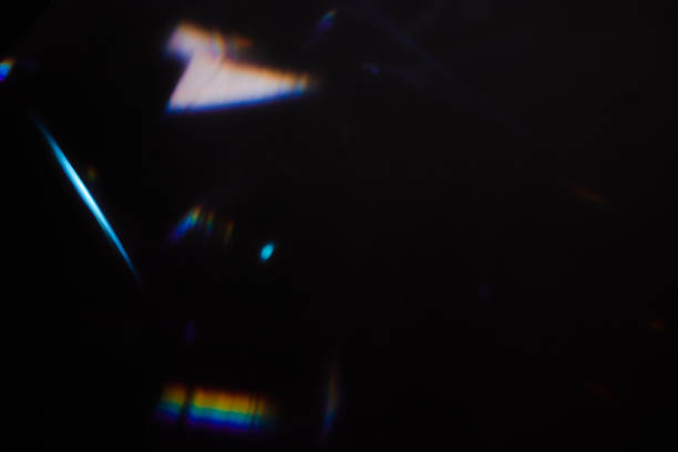 istock colorful rainbow crystal light leaks on black background 2235804965