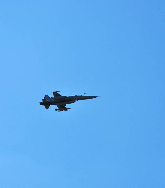 istock F-16 fighter Falcon flying through the blue sky 2235804967