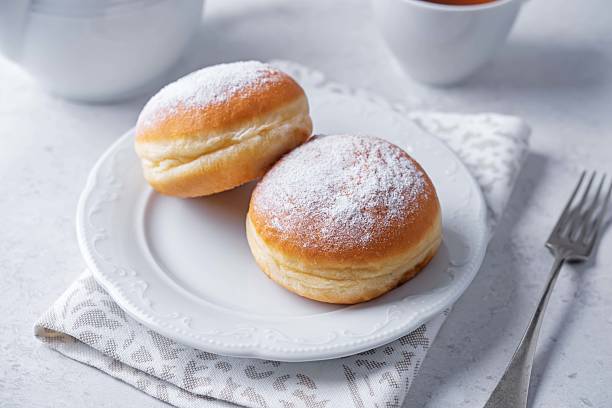 istock Berliner donuts with powdered sugar topping in a plate 2235805805