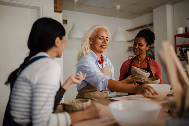 istock Multicultural Group of Three Women Decorating Pottery in Workshop 2235806474