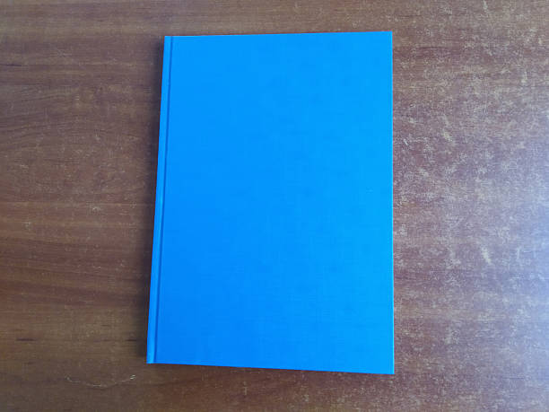 istock Blank blue book on wooden background. Copy space for text 2235808085