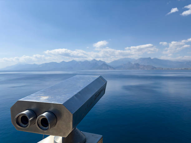 sightseeing binoculars overlooking sea