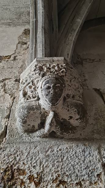 istock Beautiful roman capital depecting a praying knight (Saint-Martin Church of Limoux, southern France) 2235811231