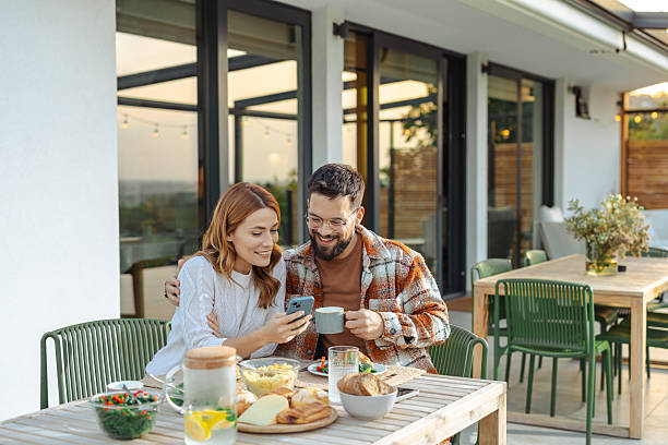 istock Couple enjoying breakfast together on a terrace with scenic views 2235814144