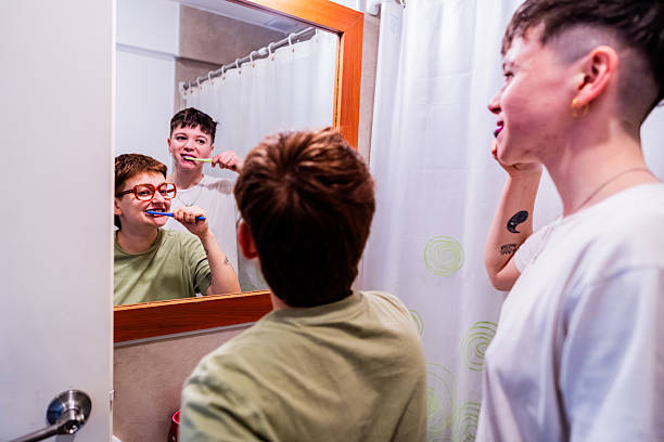 istock Young LGBTQIA+ couple brushing teeths at bathroom 2235814752