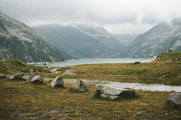 istock Lake in the Mountains with rocks in the foreground 2235815733