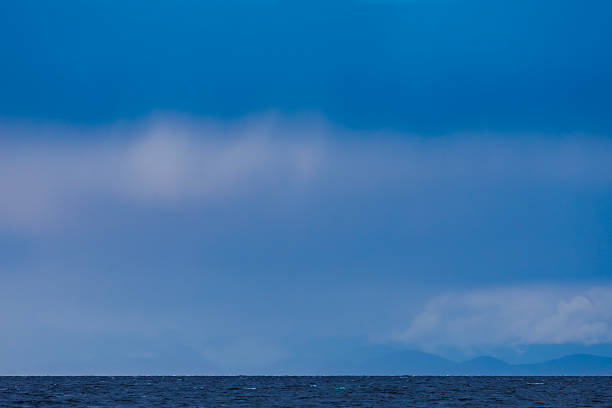 A view of the ocean, storm clouds, and coastal mountains from Hornby Island on the west coast of British Columbia, Canada. (John Gibson Photo / Gibson Pictures)