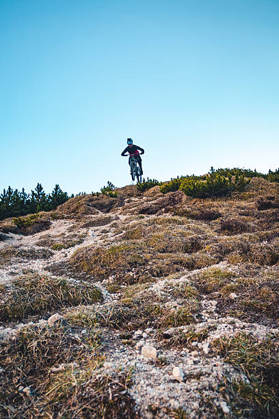 jumping a huge step up jump with the mountainbike with full safety gear.