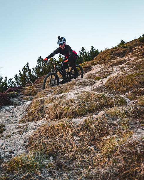 istock Male mountain biker descends steep mountain slope 2235819456