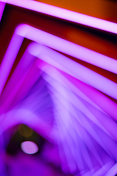 istock out-of-focus colorful light trails at vertical composition as background 2235825150