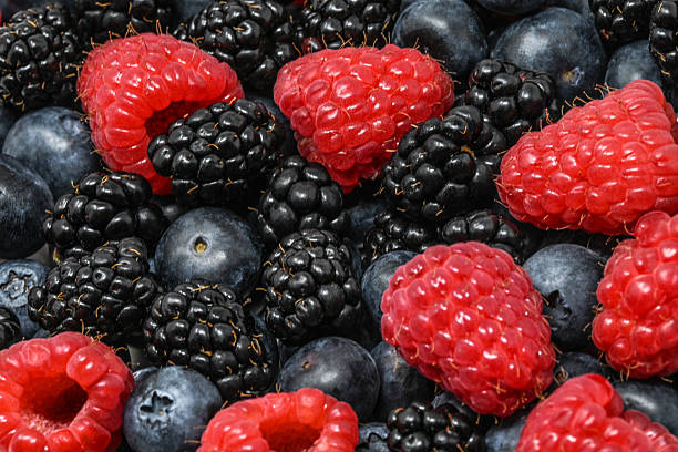 Mix of berries background. Raspberries, blackberries and blueberries