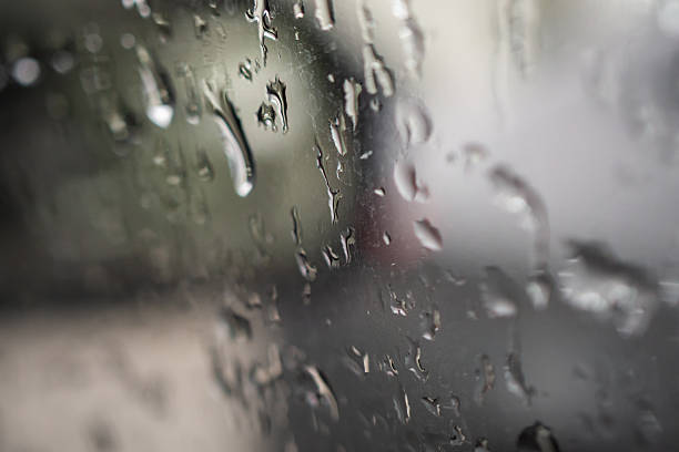 istock Wet raindrop on car glass window background 2235826916