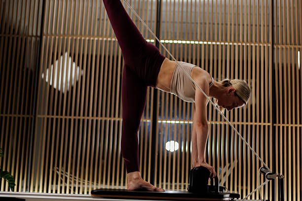 istock Fitness enthusiast practices advanced pilates moves in a modern studio during evening hours for strength and flexibility training 2235827287