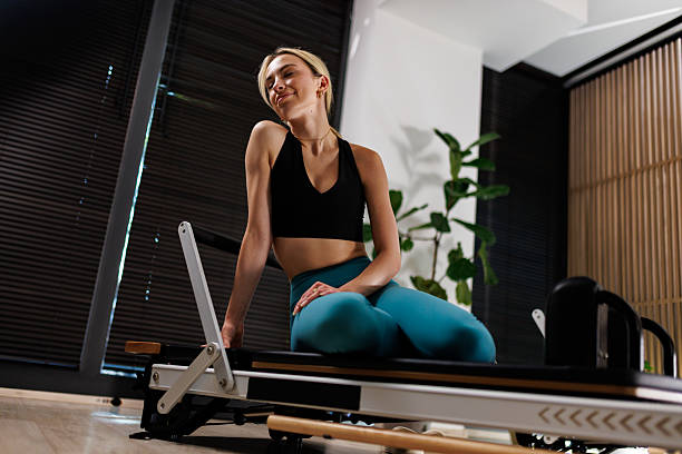 istock Fitness enthusiast relaxes after workout session in a modern studio with ample natural light and plant decorations 2235827368