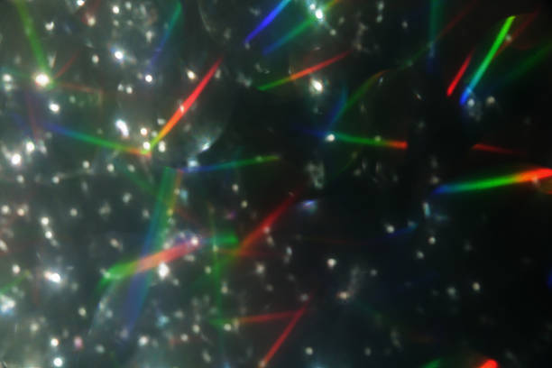 istock Colorful glitter rainbow glow light flare sparks abstract overlay texture 2235827918