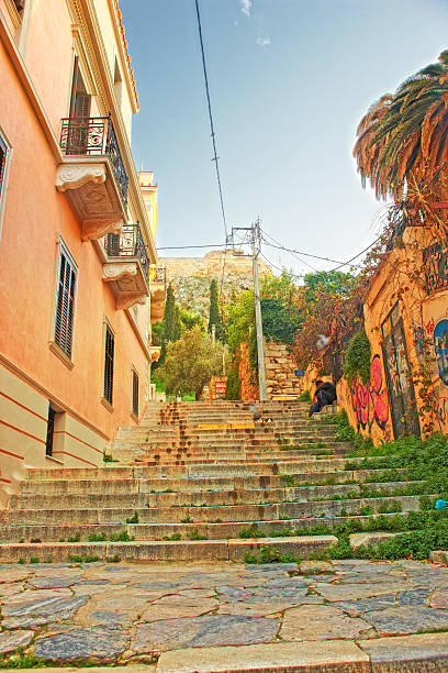 istock Charming stone staircase adorned with greenery, leading to Acropolis among historical buildings 2235827977
