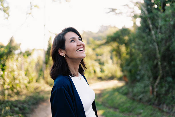 istock Woman looking up in nature 2235831918