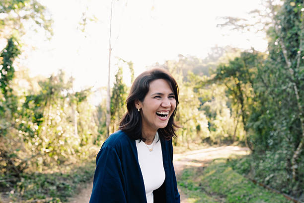 istock Woman laughing and having fun in nature 2235831919