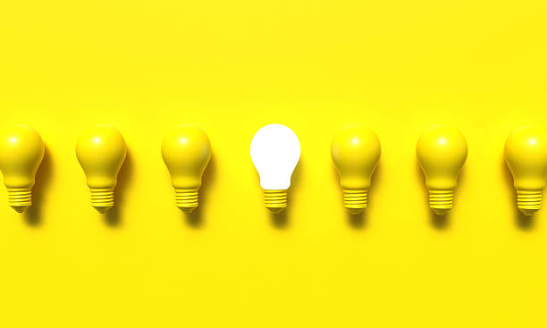 istock Lightbulb lamp group yellow orange background wallpaper glowing different innovation bright idea business lightbulb lamp glowing solution success technology thinking intelligence lightbulb lamp idea 2235834548