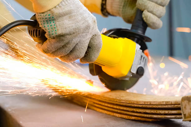 Cutting steel with angle grinder sparks from sawing car leaf springs. in Kazahstan, East Kazakhstan Region, Kazakhstan
