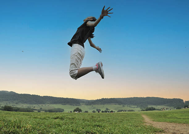 Fairy Mountain, Wulong, Chongqing, China: A Chinese girl leaps.