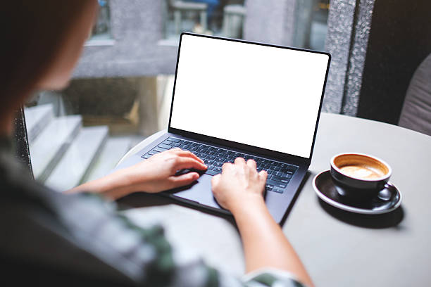 istock Mockup image of a woman working and typing on laptop computer with blank white desktop screen in cafe 2235847472