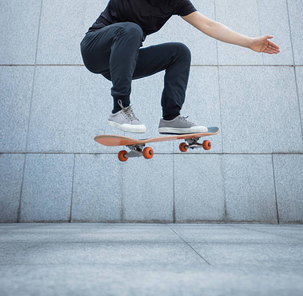 istock Skateboarder skateboarding outdoors in city 2235849109