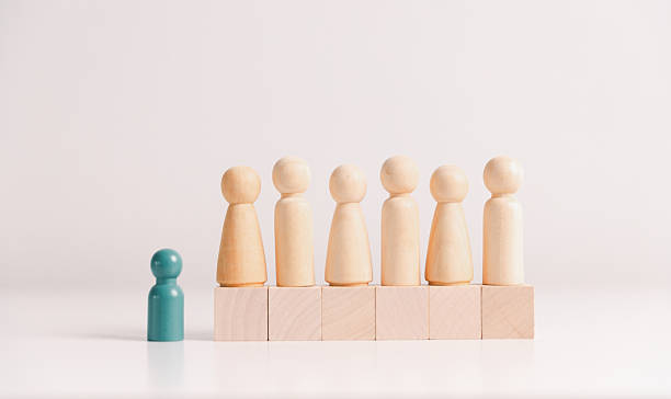 istock Concept of diversity, inclusion, equality is highlighted in team setup, wooden elements, symbolizing leadership, authority, influence, strong communication skills, inclusive organizational structure. 2235850301