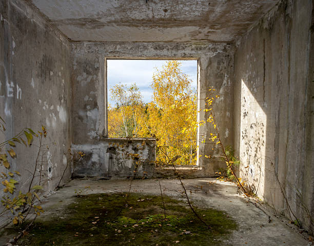 View through the hole for a balcony in a damaged abandoned panel house.