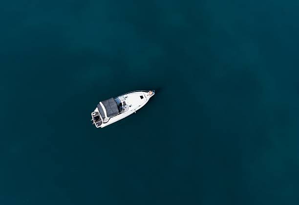 istock Solitary Yacht on Calm Waters 2235853706