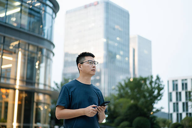 istock asian man using smart phone in urban 2235855528