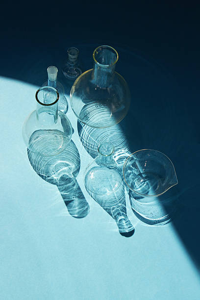 istock Chemical glassware on a blue back 2235855706