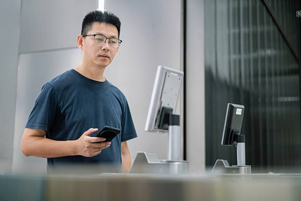 istock man passes through the office building's turnstile 2235856000
