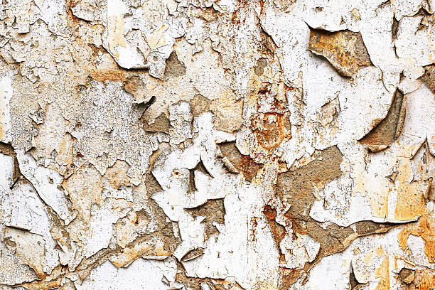 istock Old cracked paint on wall. Vintage grunge surface background. Peeling texture with rustic effect. 2235859388