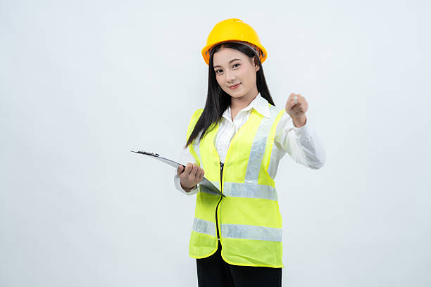 istock An Asian female engineer stands in a studio shot, dressed in a vest and hard hat, symbolizing her company's pursuit of excellence and her strong focus on project planing in the industry. 2235859617