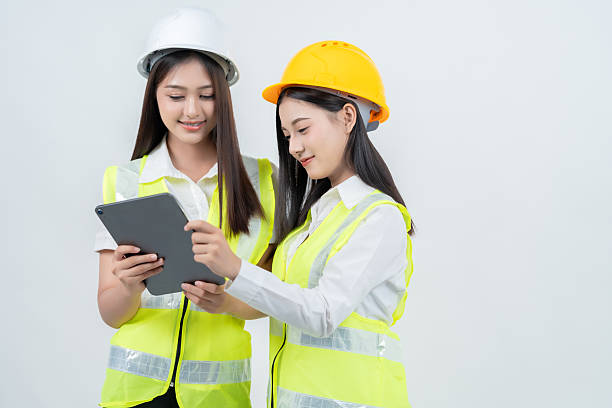 istock With creativity and precision, 2 Asian female engineers join architects to design futuristic structures, proving their company's influence in the industry and expanding global business opportunities. 2235859648