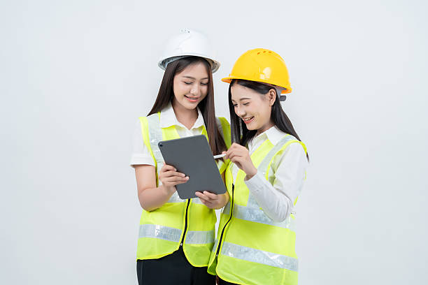 istock In a studio environment, 2 Asian female engineers share ideas with architects, creating a powerful synergy that advances the industry and positions their business in the global market. 2235859659