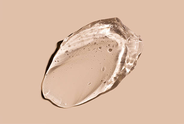 istock cosmetic texture gel essence smears on a beige background close-up 2235860877